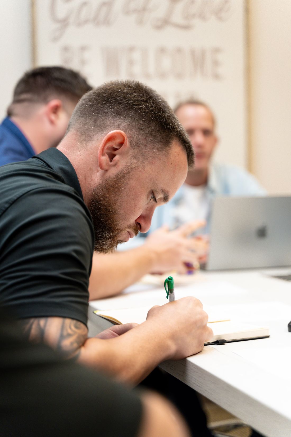 Justin Stark taking notes during a working session