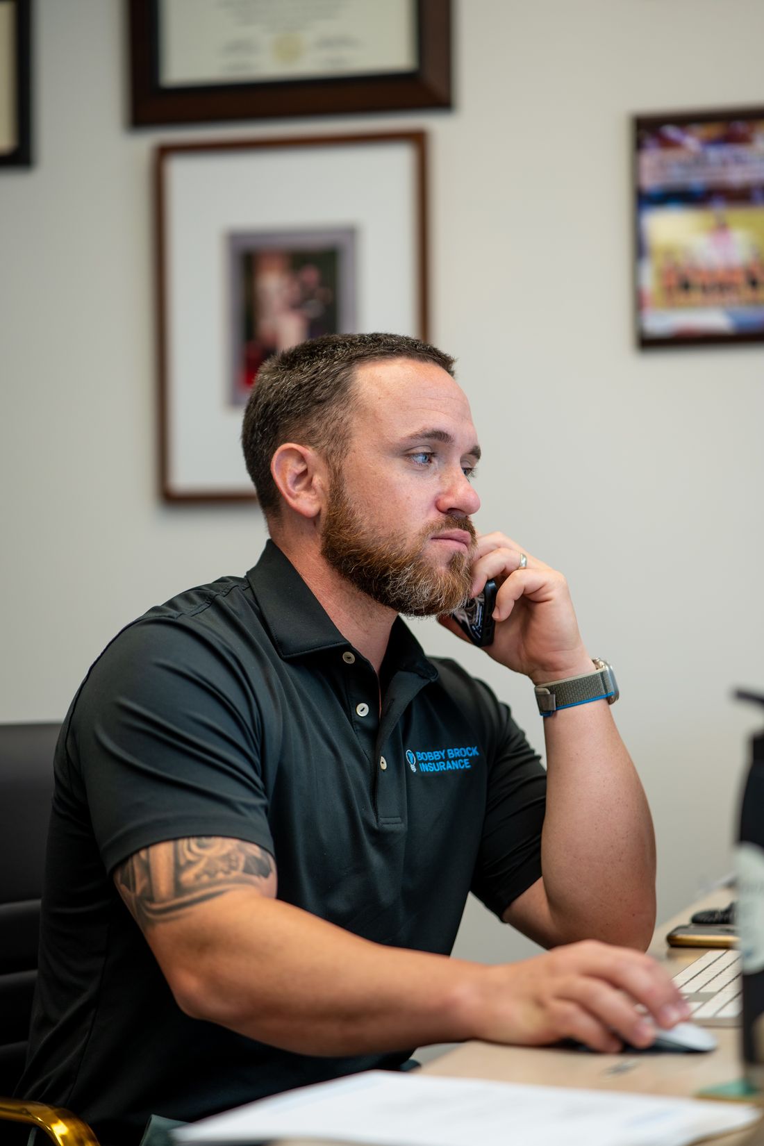 Justin Stark taking a client call at his desk